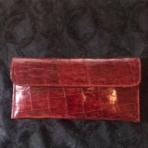 Dark red faux alligator clutch.